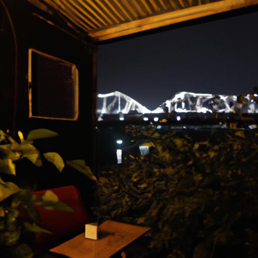 Thưởng thức cà phê và ngắm cầu Long Biên vào ban đêm với ánh đèn lấp lánh